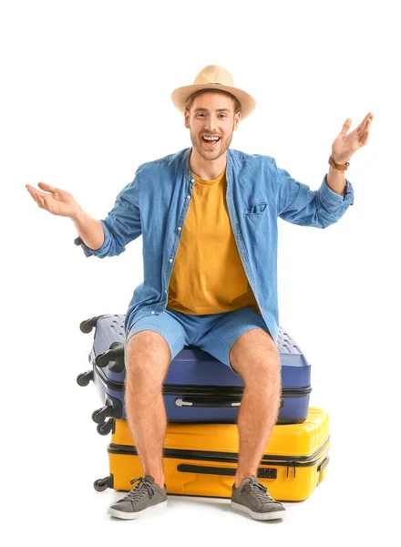 Young tourist with luggage isolated on white — Stock Photo, Image