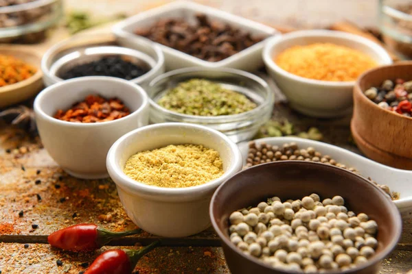Different spices on wooden table — Stock Photo, Image