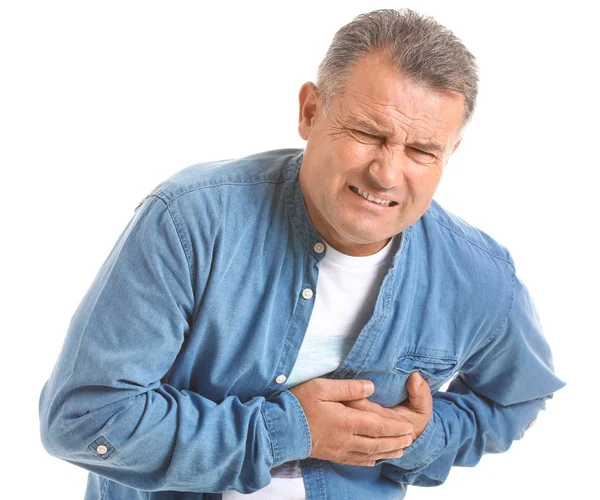 Mature man suffering from heart attack on white background — Stock Photo, Image