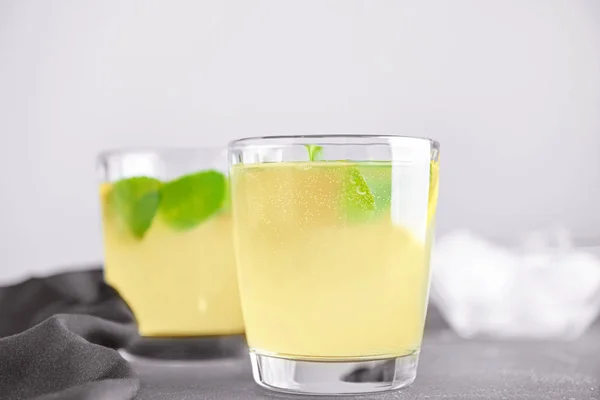 Glass of tasty lemonade on table — Stock Photo, Image