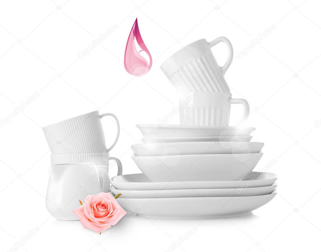 Clean tableware and drop of dishwashing liquid on white background