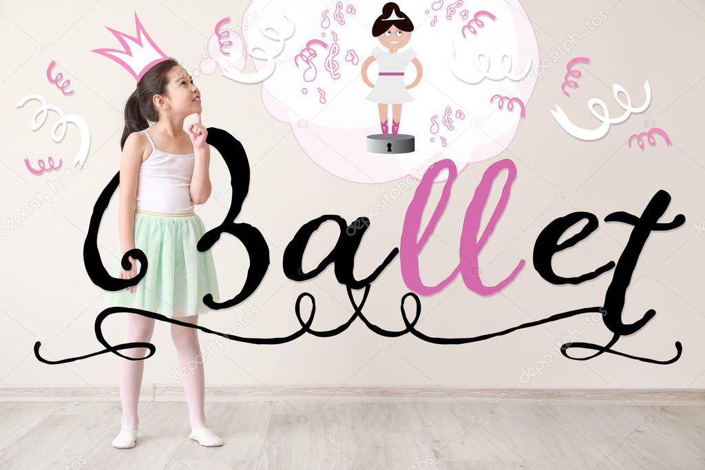 Cute little girl dreaming of becoming ballerina while standing near light wall