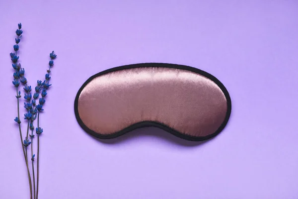 Sleep mask with lavender on color background — Stock Photo, Image