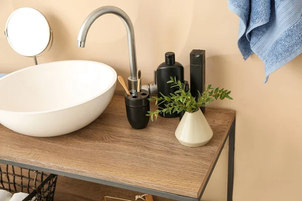 Body care cosmetics with accessories near sink in bathroom — Stock Photo, Image