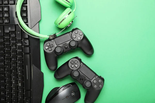 Modern gaming accessories on color background — Stock Photo, Image