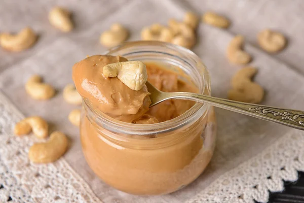 Jar of cashew butter on table — Stock Photo, Image