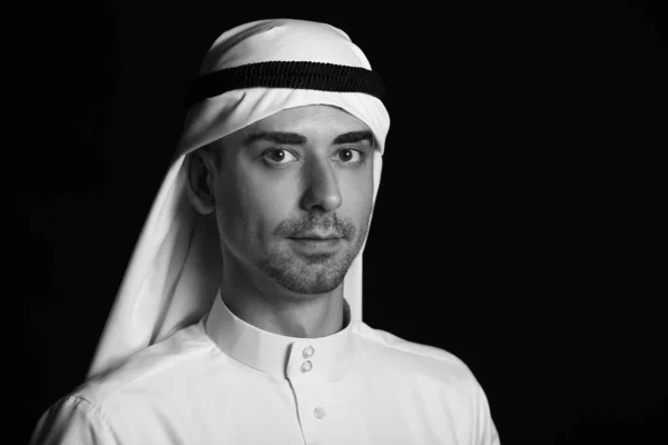 Black and white portrait of handsome Arab man on dark background — 스톡 사진