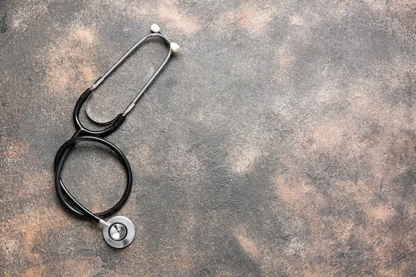 Modern stethoscope on grunge background — Stock Photo, Image