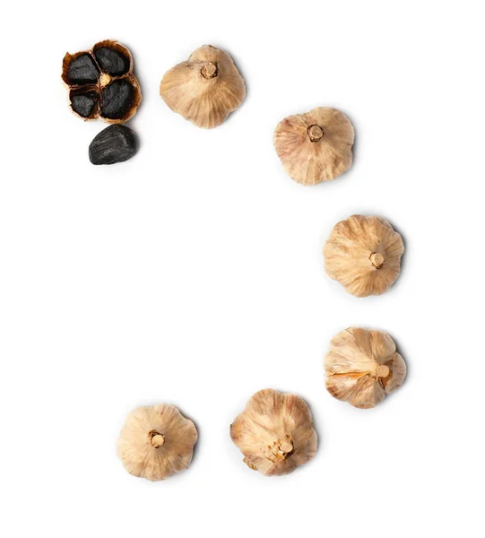 Black garlic on white background — Stock Photo, Image