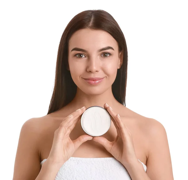 Beautiful young woman with cream on white background — Stock Photo, Image