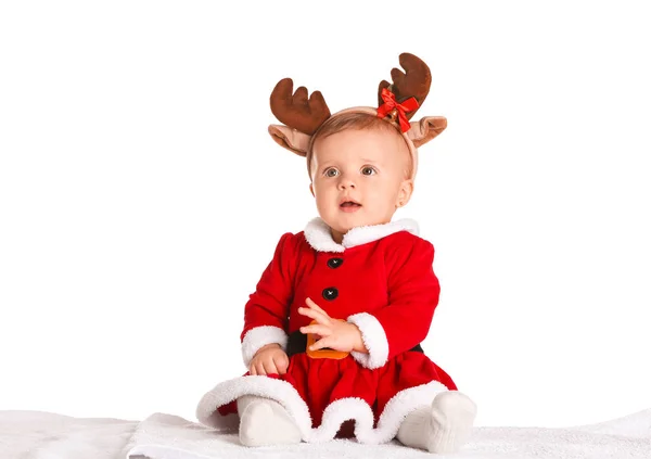 Cute little baby in Santa Claus costume and deer horns on white background — Stock Photo, Image