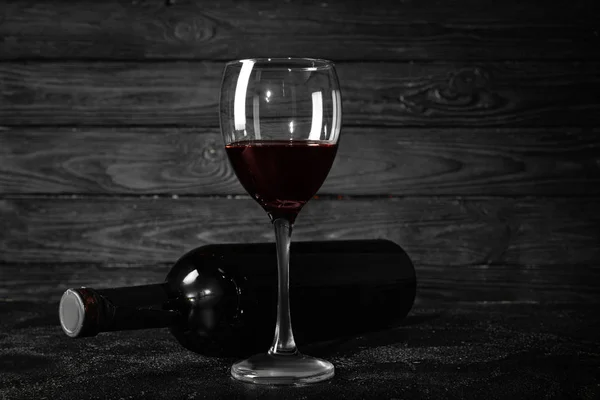 Bottle and glass of wine on table. Concept of alcoholism — Stock Photo, Image