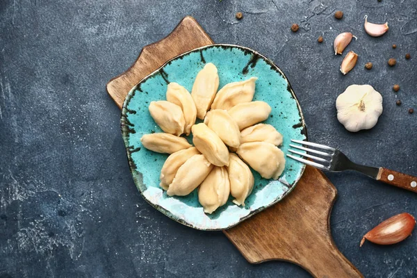 Plate with tasty dumplings on table — Stock Photo, Image