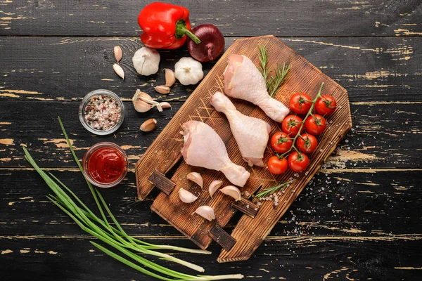 Composition with raw chicken meat on wooden background — Stock Photo, Image