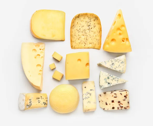Assortment of fresh cheeses on white background — Stock Photo, Image