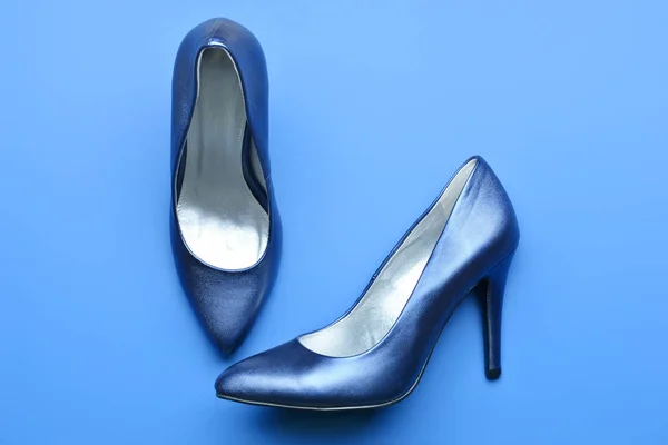 Blue high-heels on color background — Stock Photo, Image