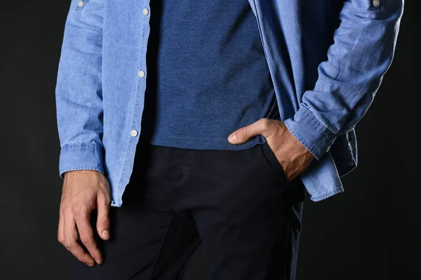 Man in stylish blue clothes on dark background, closeup — Stock Photo, Image