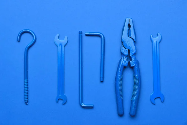 Set of tools on blue background — Stock Photo, Image