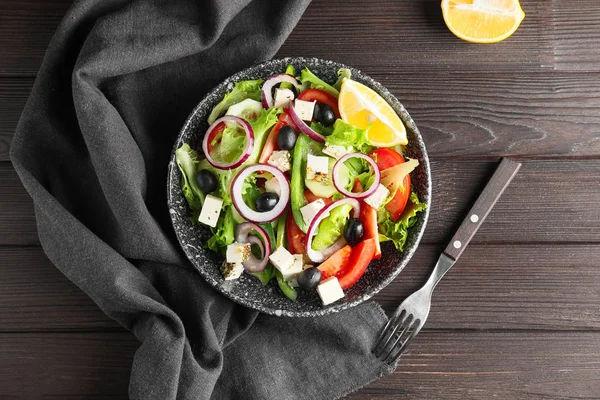 Plate of tasty Greek salad on table — Stock Photo, Image