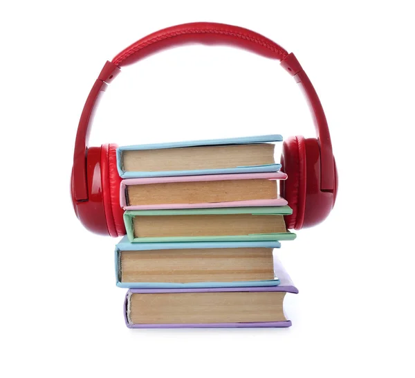 Books and modern headphones on white background. Concept of audiobook — Stock Photo, Image