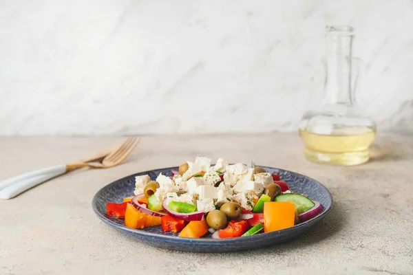 Plate with fresh Greek salad on table — Stock Photo, Image