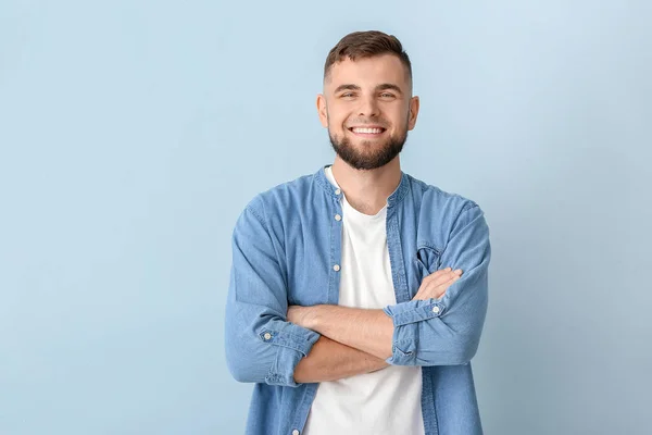 Handsome young man on color background — Stock Photo, Image