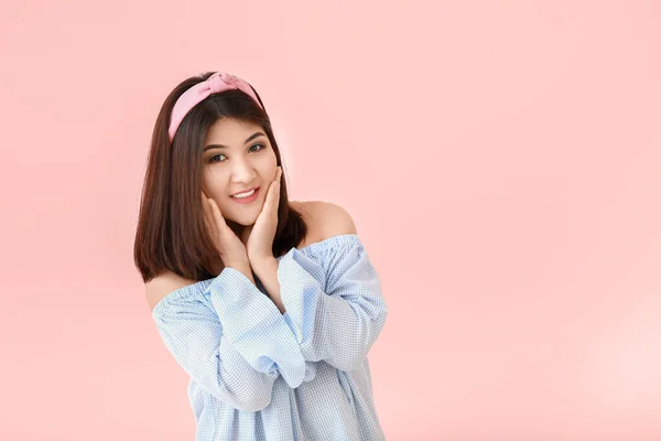 Portrait of beautiful young Asian woman on light background — Stock Photo, Image