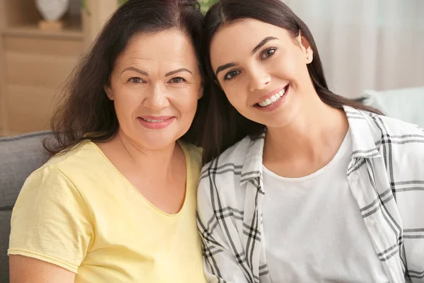 Portrait of mature woman and her adult daughter at home — Stock Photo, Image