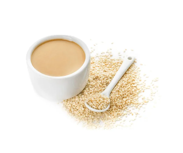 Bowl of tasty tahini on white background — ストック写真