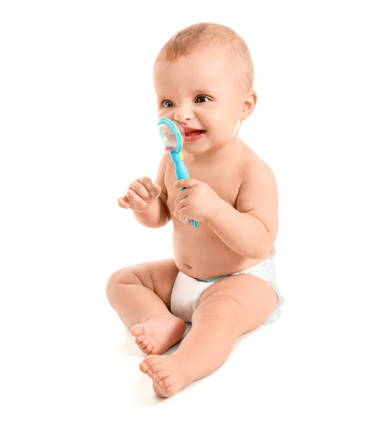 Portret van schattige kleine baby met speelgoed op witte achtergrond — Stockfoto
