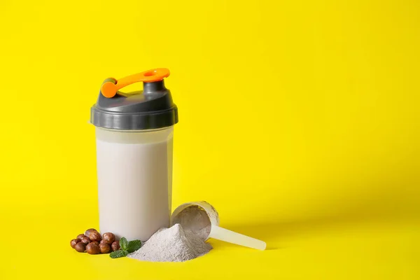 Bottle of protein shake on color background — Stock Photo, Image