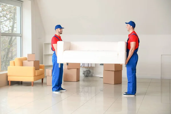 Loaders carrying furniture on moving day