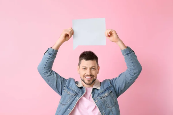 Man with blank speech bubble on color background — Stok Foto