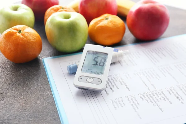 Laboratory test, glucometer, fruits and lancet pen on table. Diabetes concept — 스톡 사진