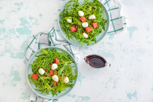 Plates with tasty salad on table — Stock Photo, Image