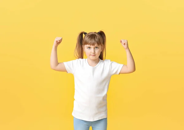 Strong little girl on color background. Concept of feminism — Stock Photo, Image