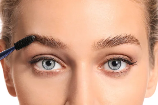 Young woman undergoing eyebrow correction procedure, closeup — Stock Photo, Image