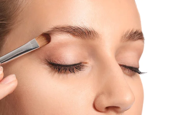 Young woman undergoing eyebrow correction procedure, closeup — Stock Photo, Image