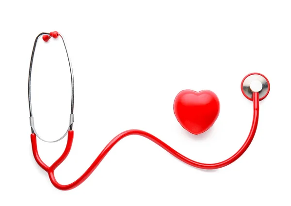 Stethoscope and red heart on white background — Stock Photo, Image