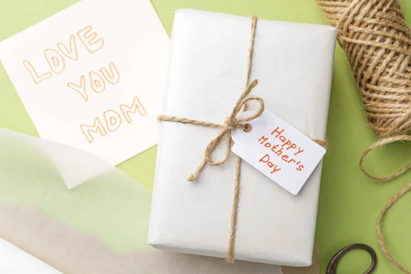 Gift for Mother's Day on color background — Stock Photo, Image