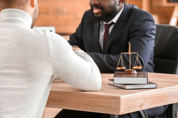 Man visiting lawyer in office