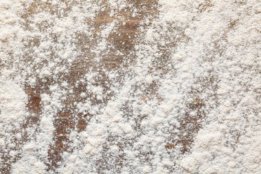 Ahşap arka plan üzerinde dağınık un