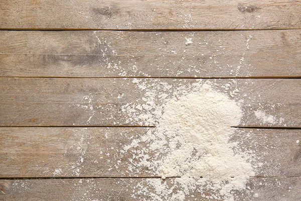 Scattered flour on wooden background — Stock Photo, Image