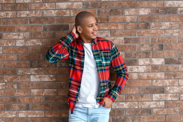 Stylish African-American man near brick wall — 스톡 사진