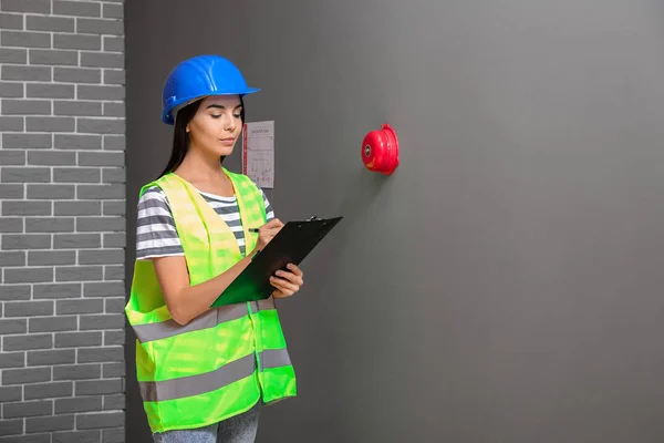 Fire safety specialist inspecting building