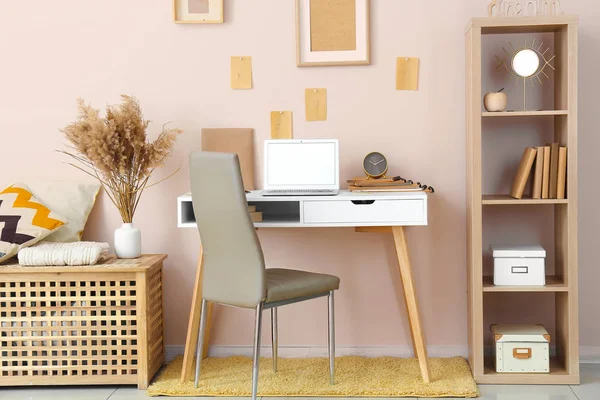 Stylish comfortable workplace with laptop in modern room — Stock Photo, Image