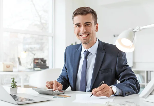 Male bank manager working in office