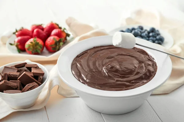 Bowl with tasty chocolate fondue and marshmallow on table — Stock Photo, Image