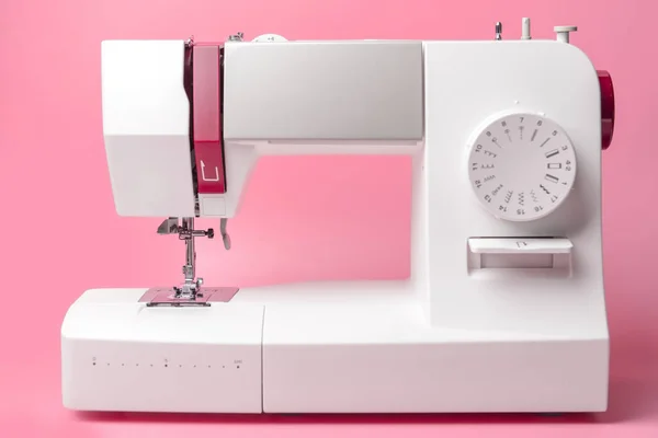 Sewing machine on color background — Stock Photo, Image