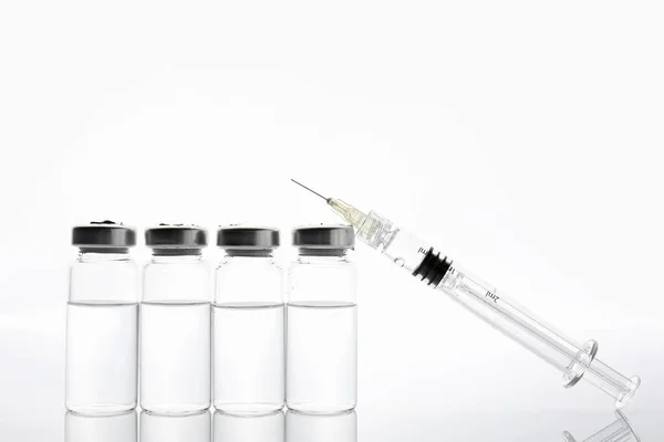 Syringe and ampules with filler for cosmetology on white background — 스톡 사진